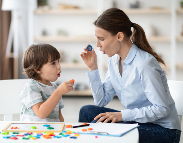 A mother and child playing a colorful educational game together.